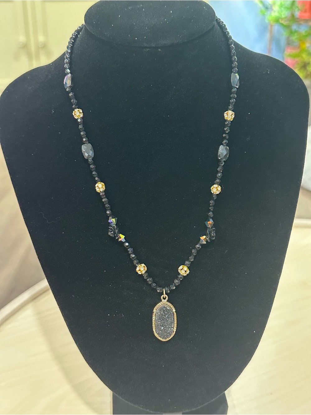 Gold-Accented Black Beaded Necklace with Sparkling Druzy Pendant